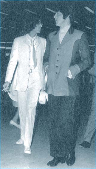 2: John Lennon and Paul McCartney in the airport on their journey to the U.S. to promote Apple Corps in 1968. Both the boys look quite dapper in their stylish suits.